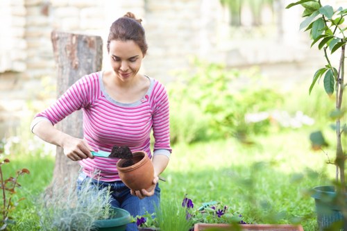 Professional technician using high-pressure cleaning tools