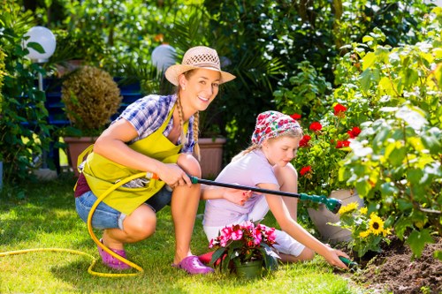 Integrated gardening and pressure washing service in action.